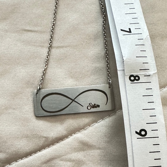 Silver tone rectangular plate on chain w/etched infinity symbol says “Sister” - Picture 8 of 15
